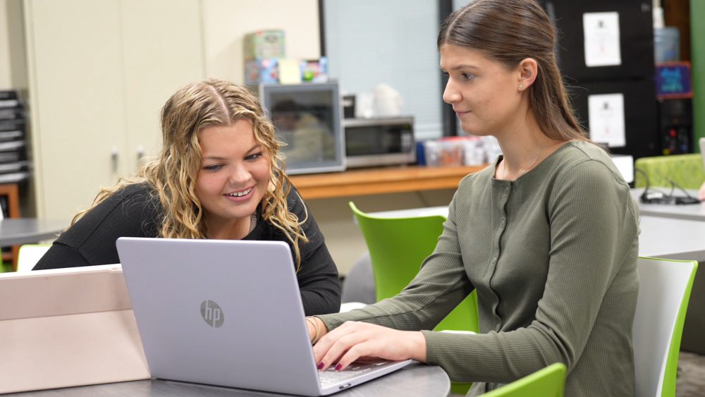 students at a laptop