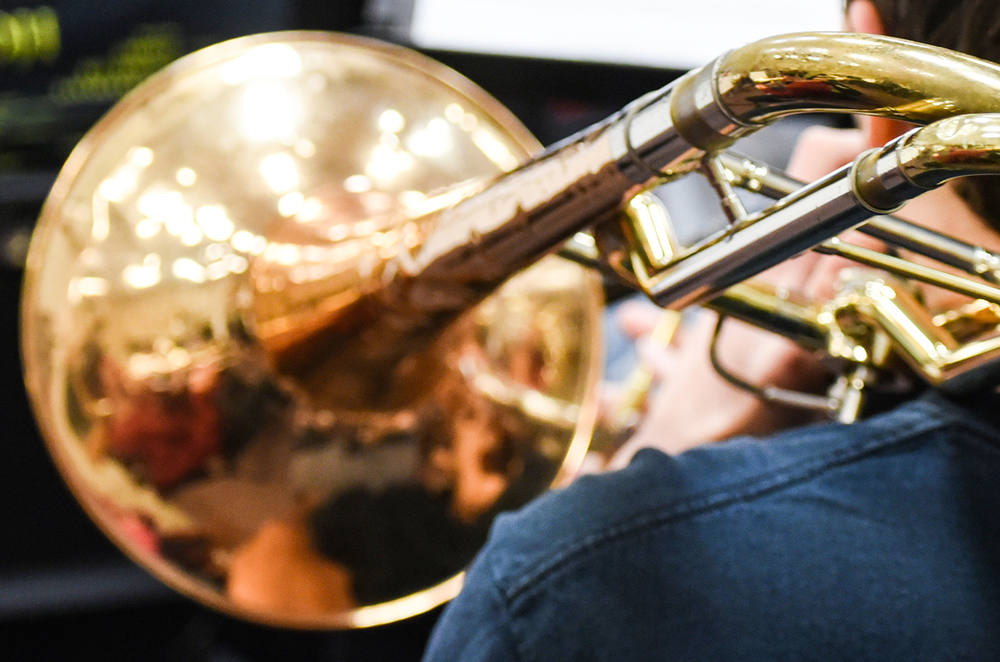 student playing trombone