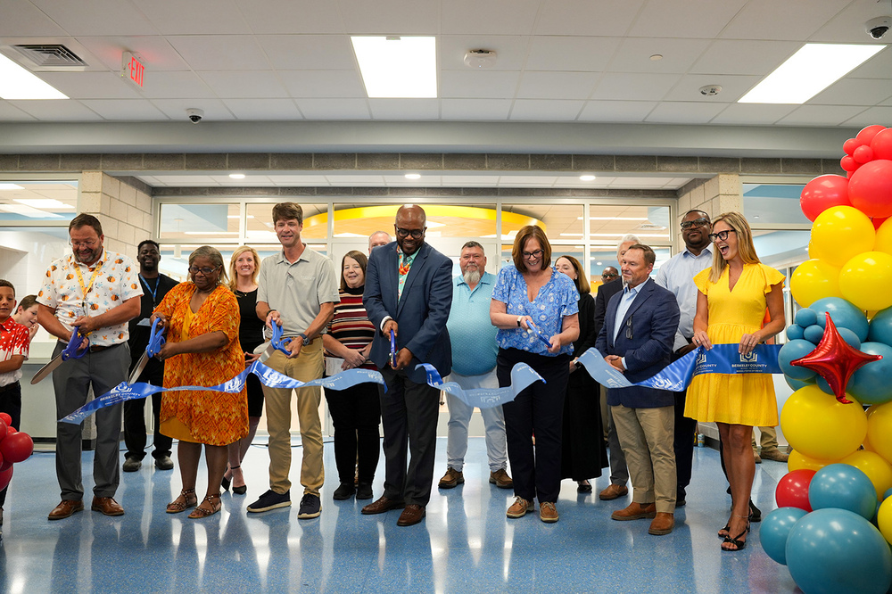 Dr.Dixon and government officials cutting ribbon on Bee Tree Elementary
