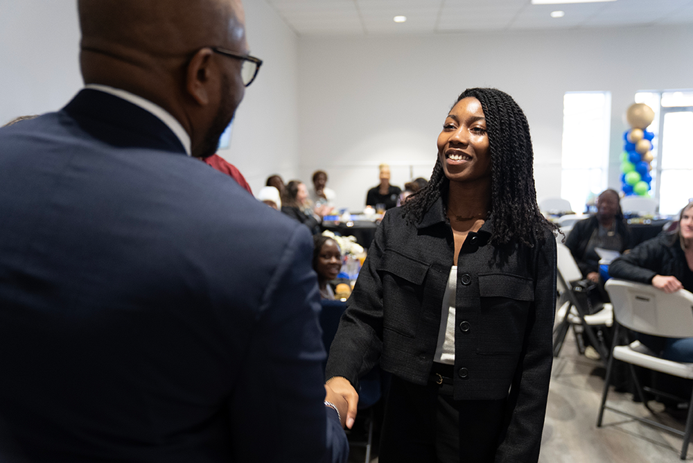 student receiving award at MLK Luncheon