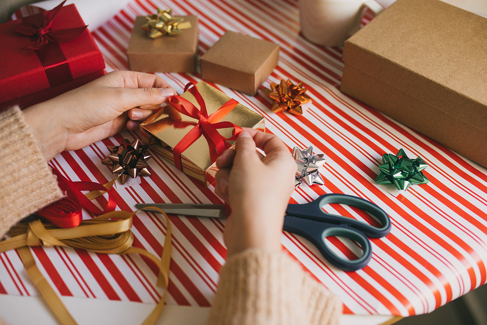 person wrapping gifts