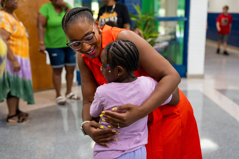 principal hugging student