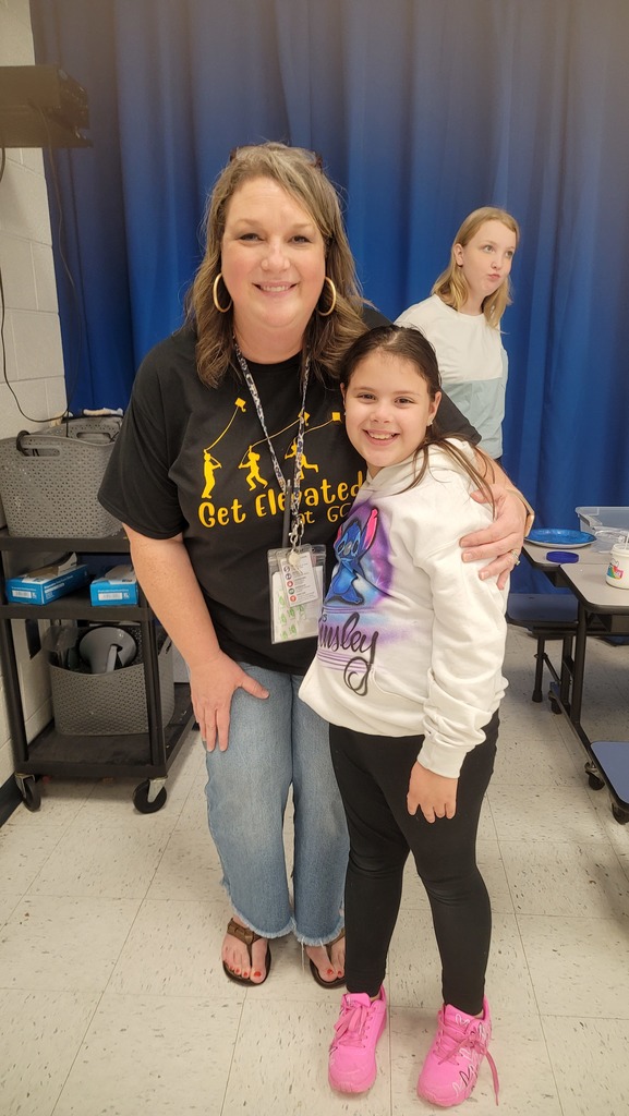 Teacher and student enjoying reading night together.