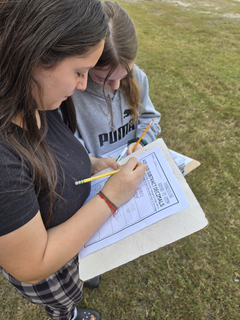 two students working on a sheet