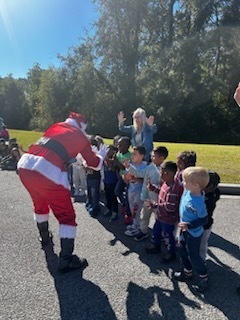 Santa saying hello to the students
