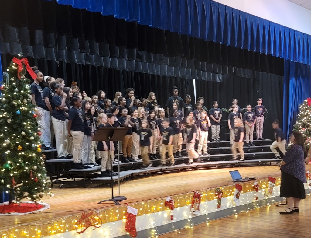 Students walking on to the risers