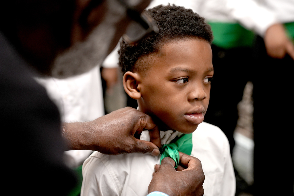 SSE student getting bow tie put on