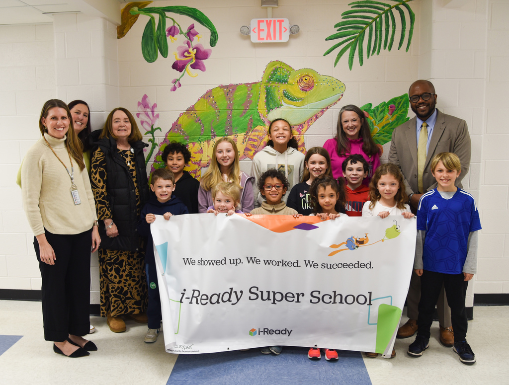 HHA students with i-Ready banner and school and district administration