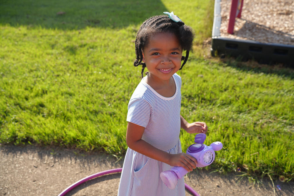 child with bubble machine