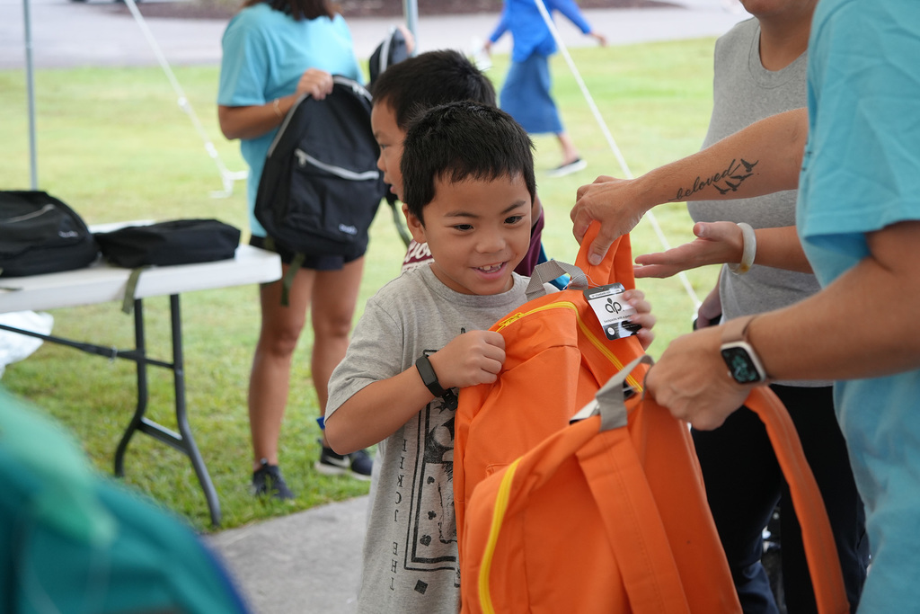 child with bookbag