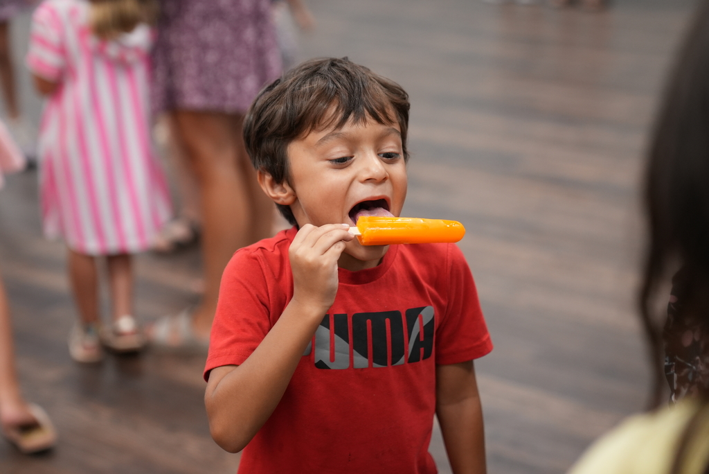 student eating popsicle