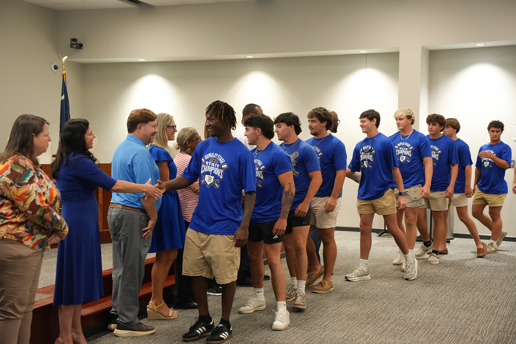 BHS baseball shaking board members hands