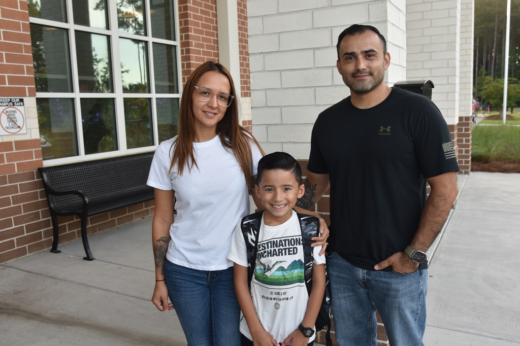 student smiling with family