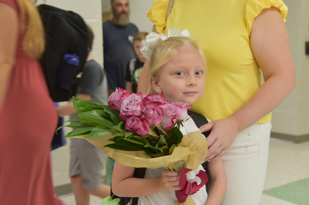 student with bouquet 