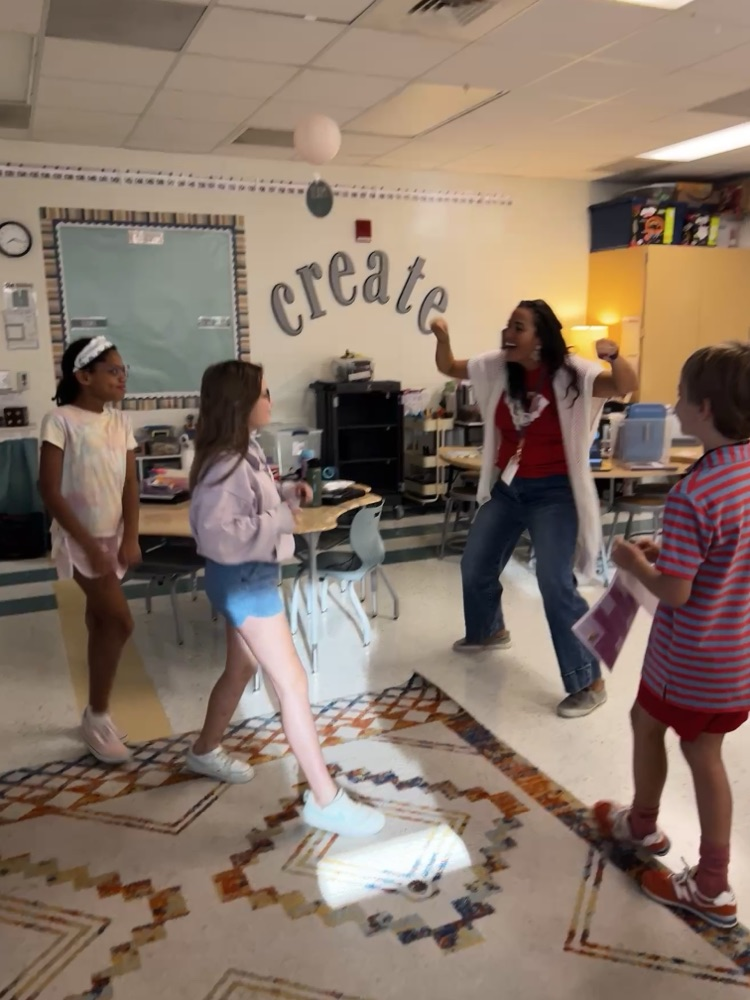 students and teacher celebrating