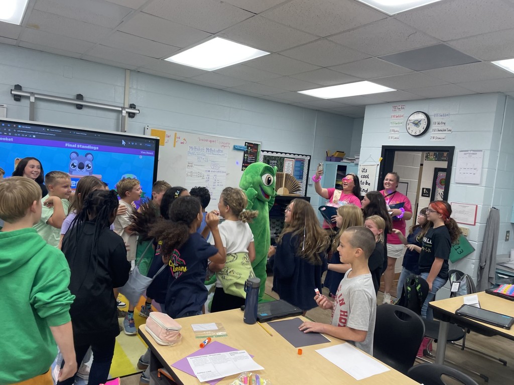 Excited students with school mascot