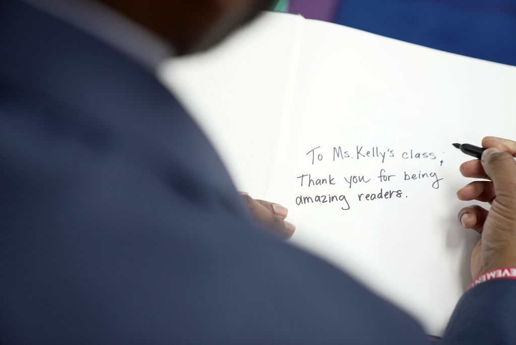 Dr. Dixon writing note for class 
