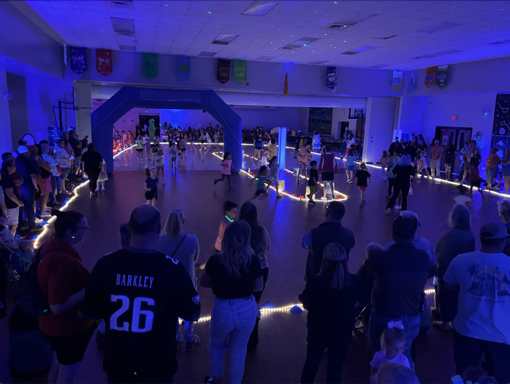 Picture of our multi purpose room turned into a glow in the dark race course! 
