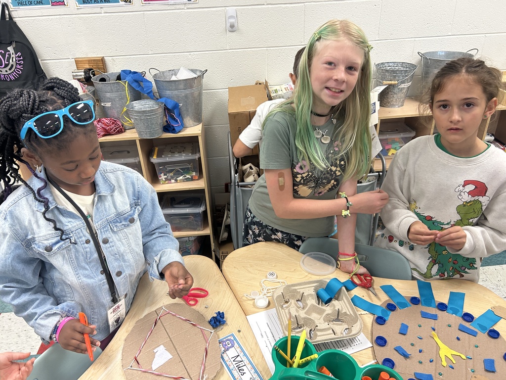 The girls work on their Poseidon shield.