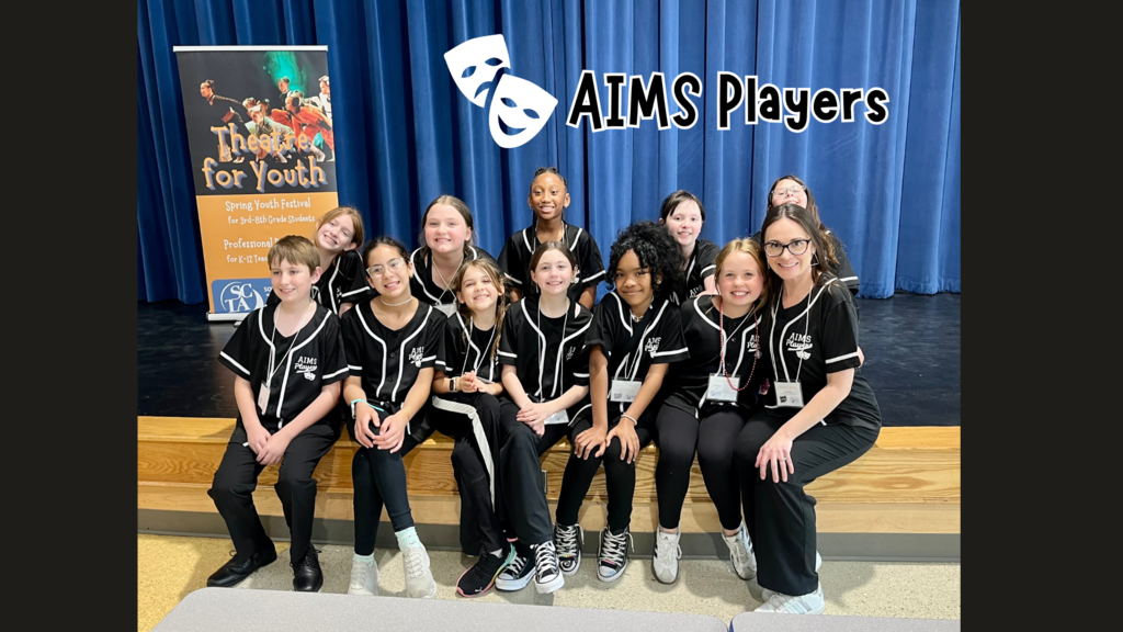 AIMS Players performing group smiling at Theatre for Youth event