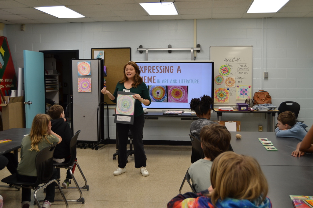 Students learning from an artist in residence