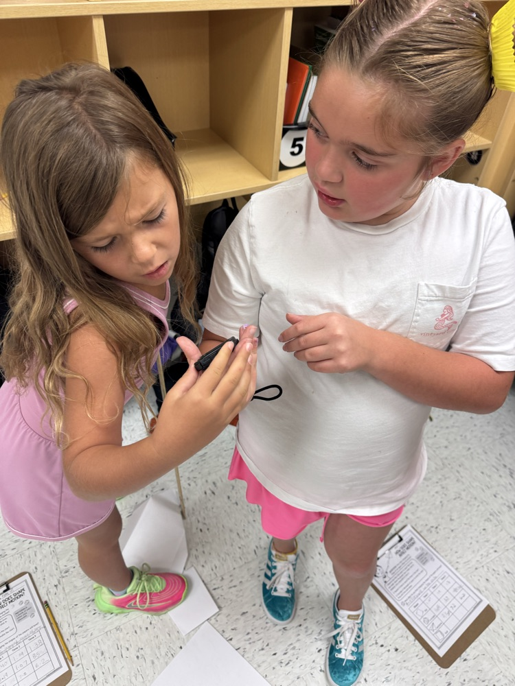 students looking at a stop watch
