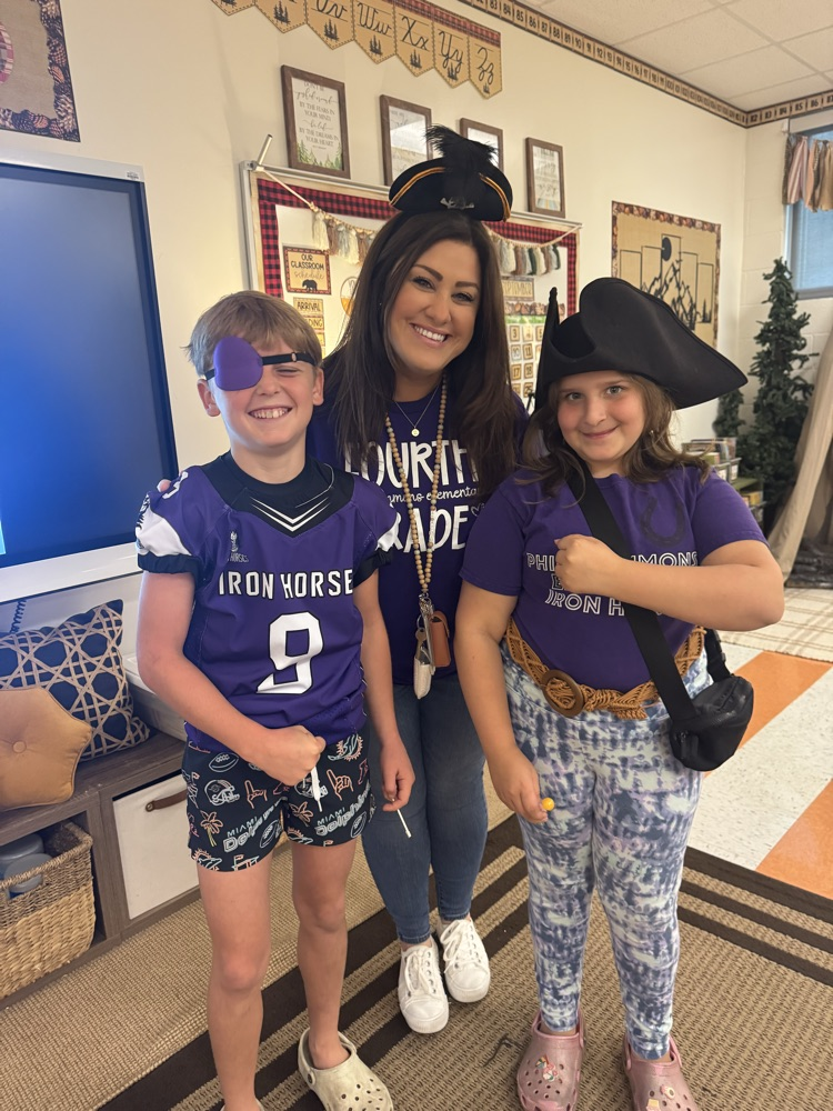teacher with kids in pirate costumes 