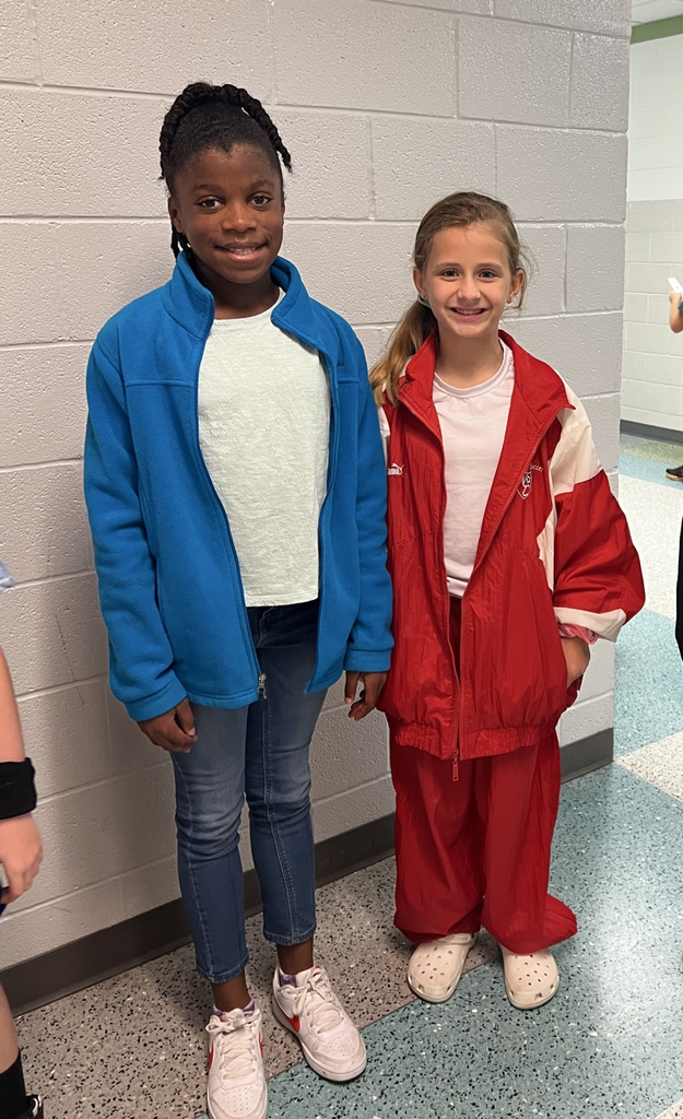 kids in track suits smiling 