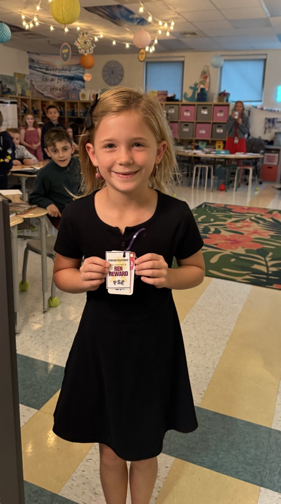 student holding ren reward 