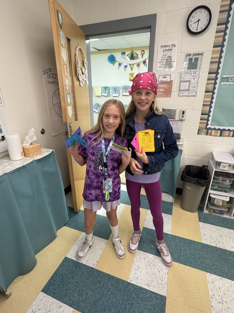 students holding ren reward teacher cards