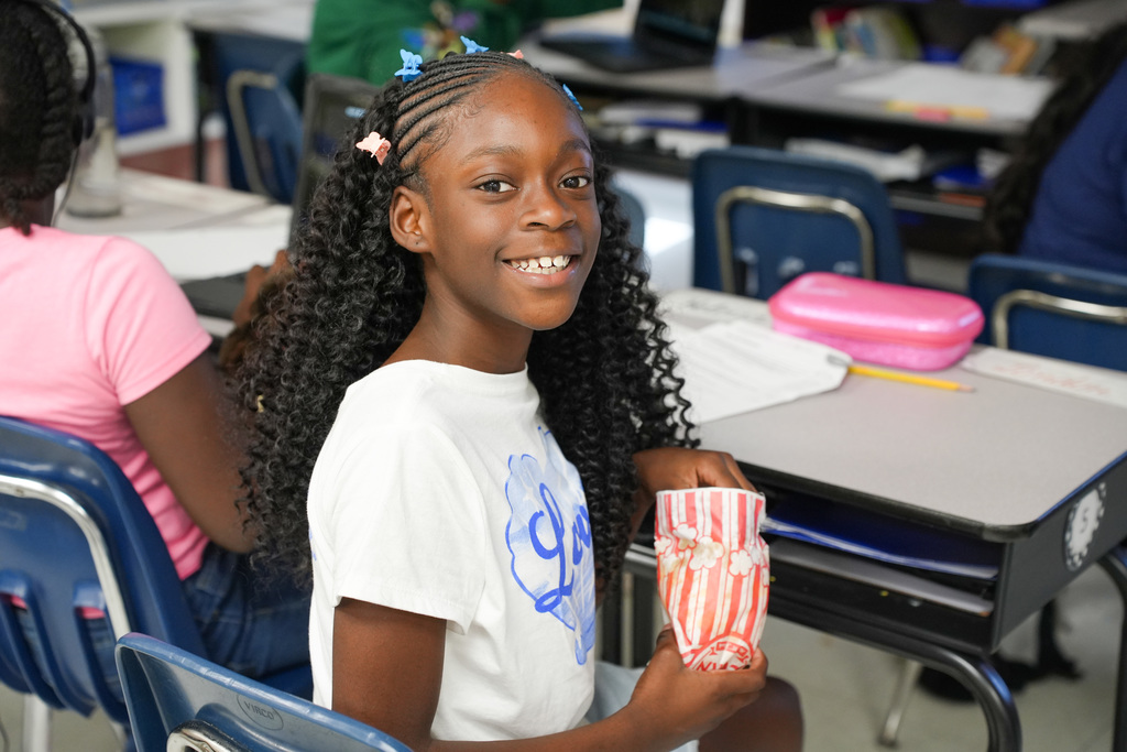 student with popcorn