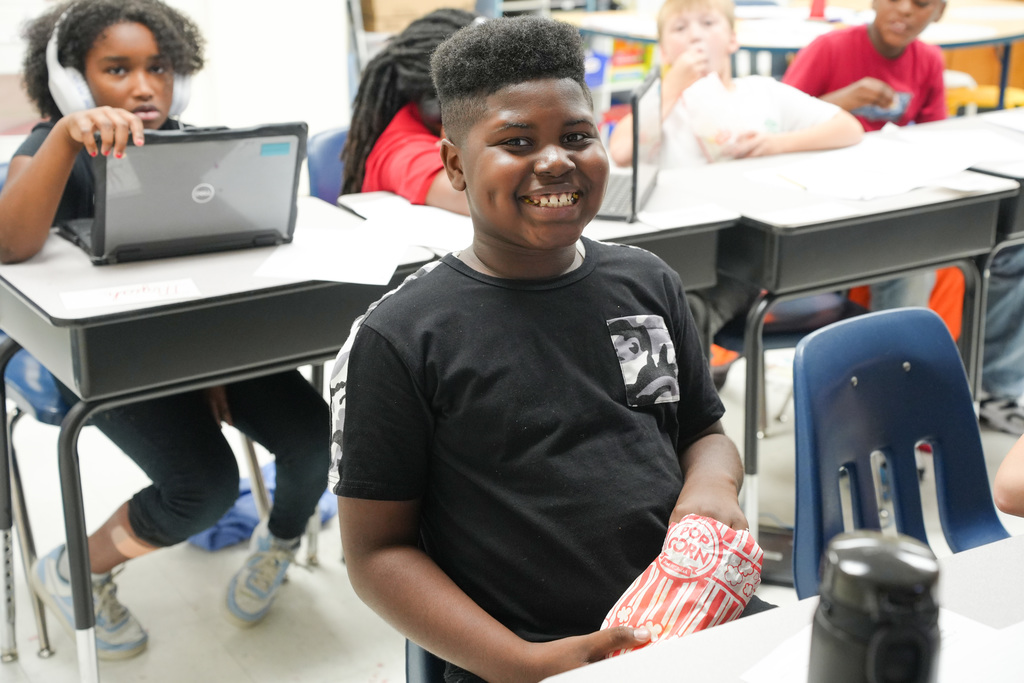 student eating popcorn