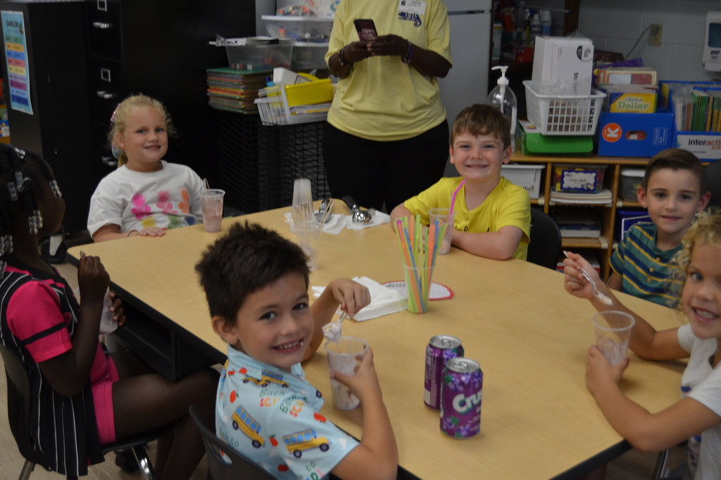 Kids enjoying grape soda and ice cream