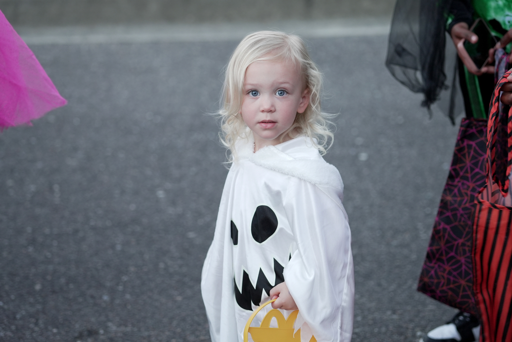 student in ghost costume