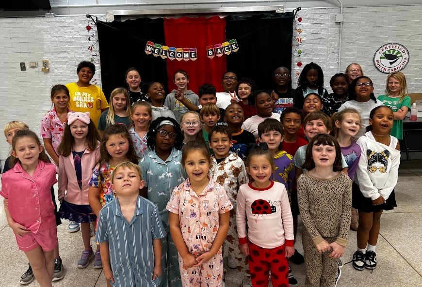 This is a photo that includes all students who were nominated by their teacher for the trait of respect. There is one student from every class pictured and the students enjoyed making a silly face.