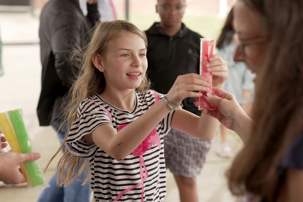 student getting popsicle