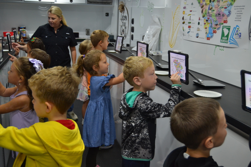 Kids looking at a screen