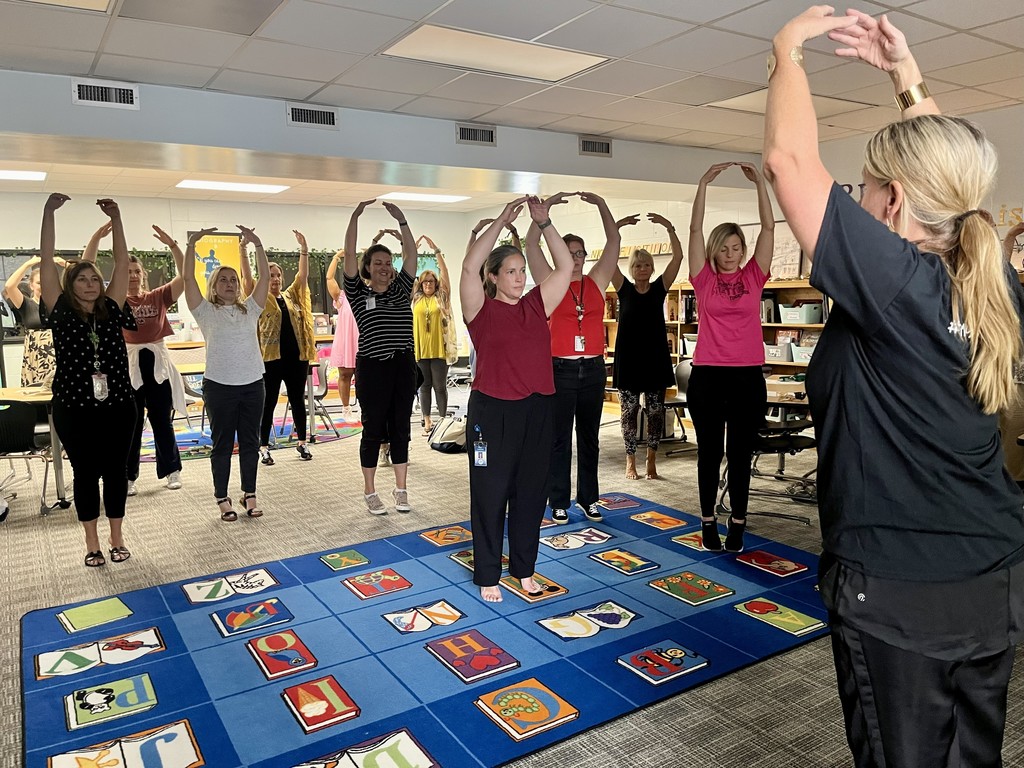 Teachers dancing during an afterschool PD