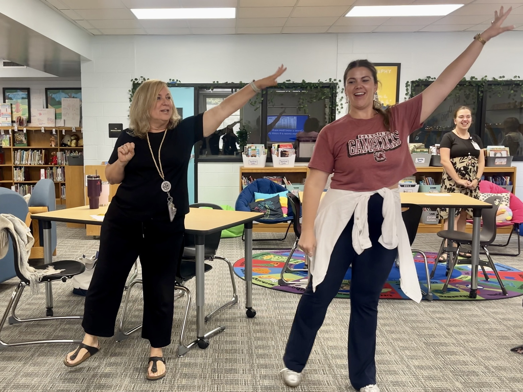Teachers dancing during an afterschool PD session