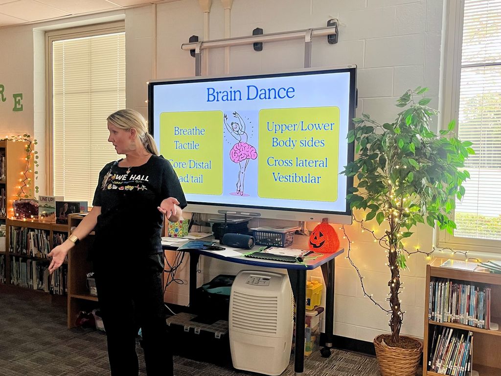 HHA Dance Teacher sharing slides about the Brain Dance