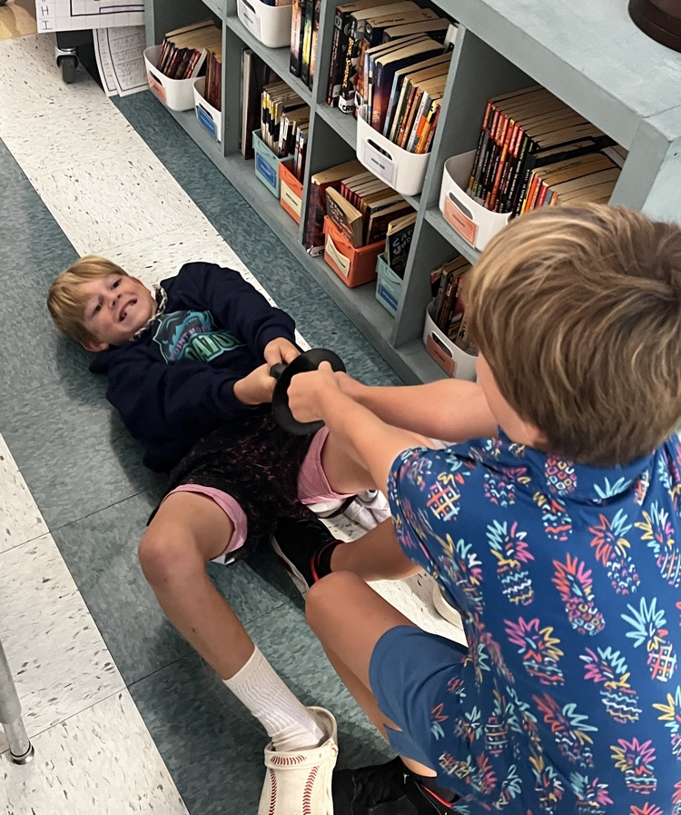 students pulling suction cups