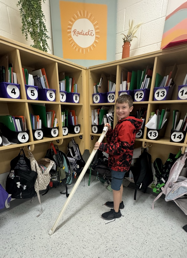student with ramp to make toy car move downward