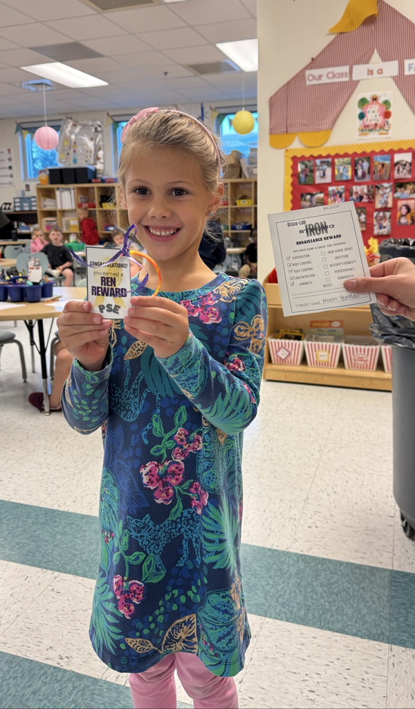 student holding ren reward 
