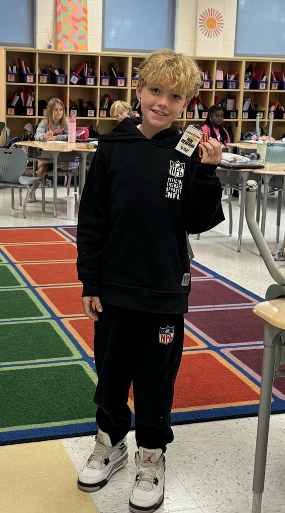 student holding ren reward