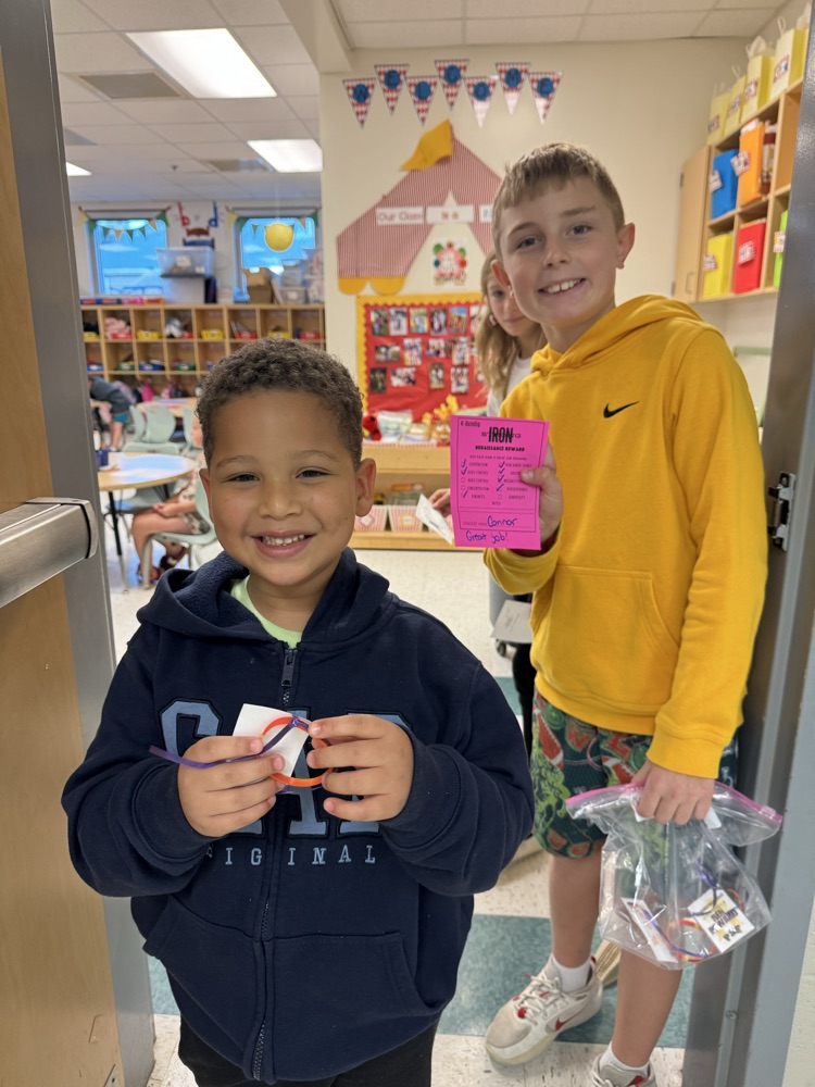 student holding ren reward