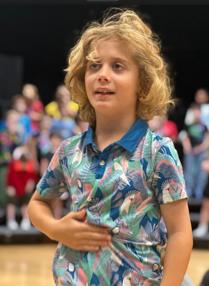 Student rehearsing on stage