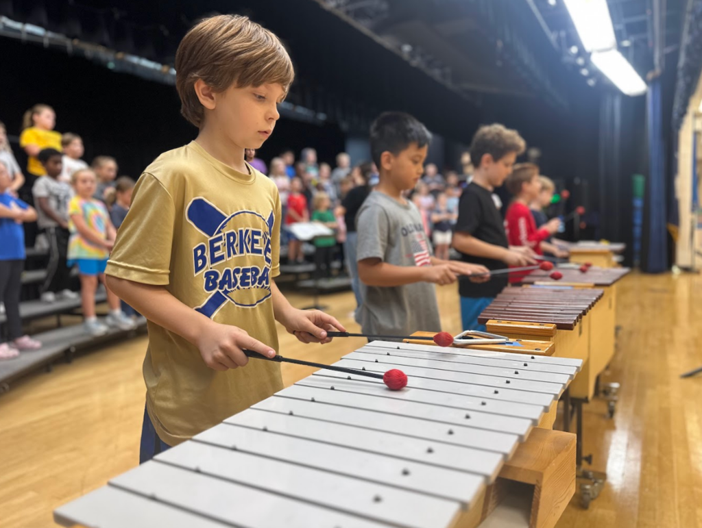 Student playing a xylophone