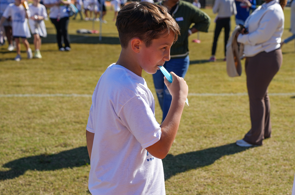 student eating popsicle