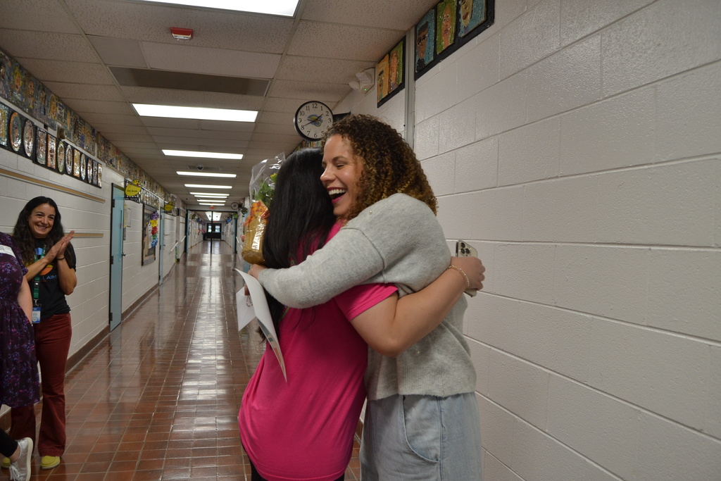 Congratulations hug for Ms. Carley