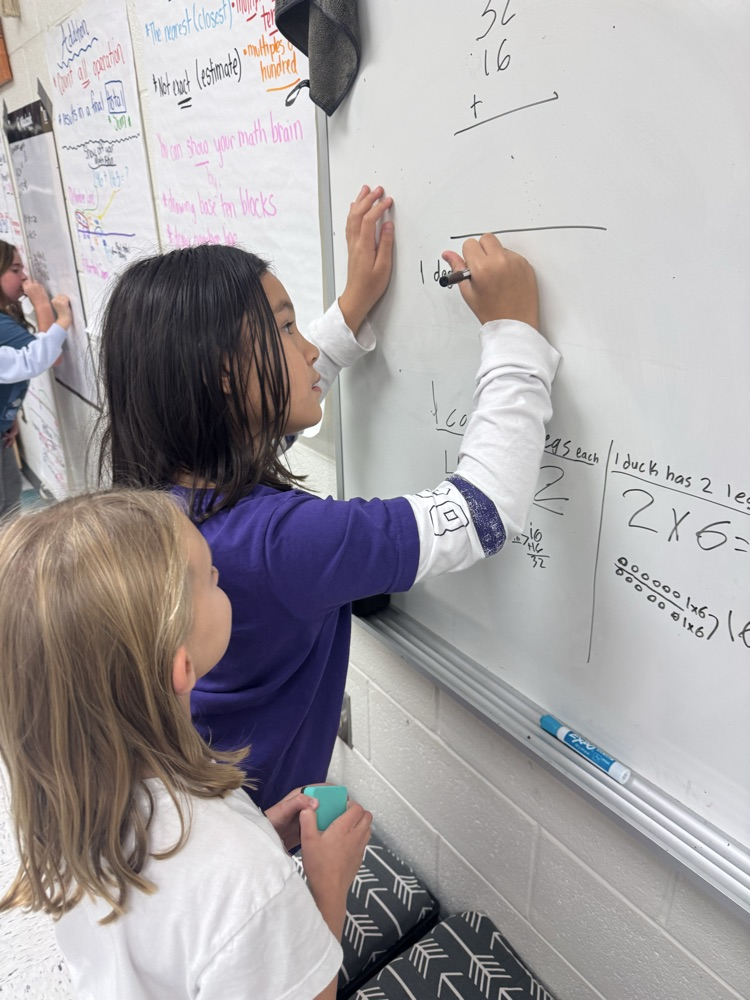 students working together on math problem 